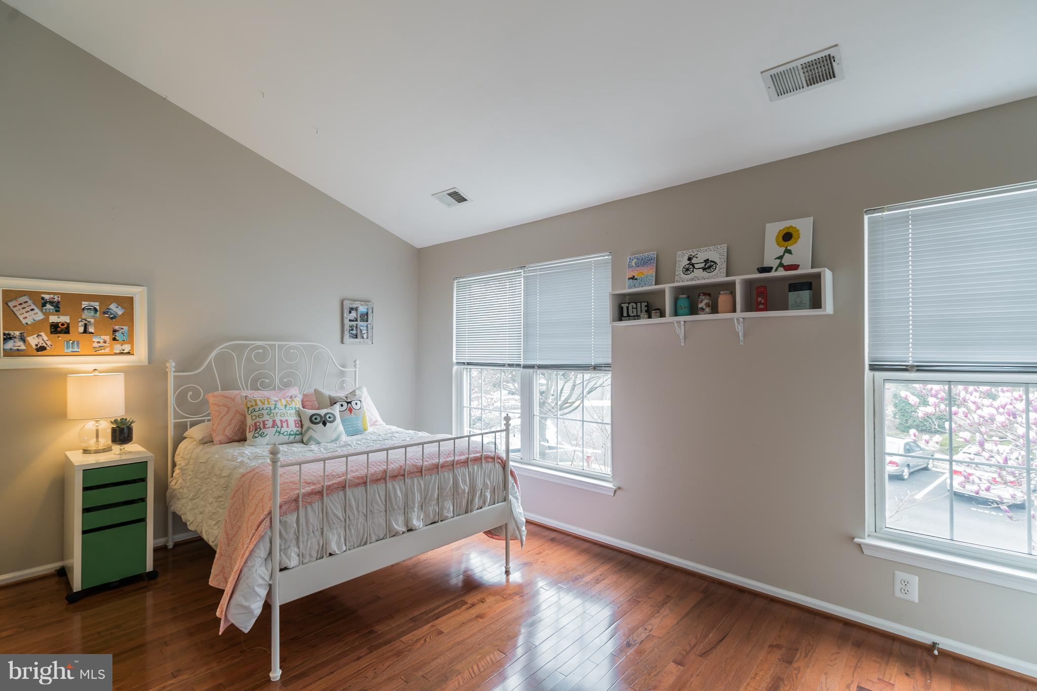 11459 Heritage Commons Way Reston, VA 20194 - Photo 14 of 30 a bedroom with a bed and a window