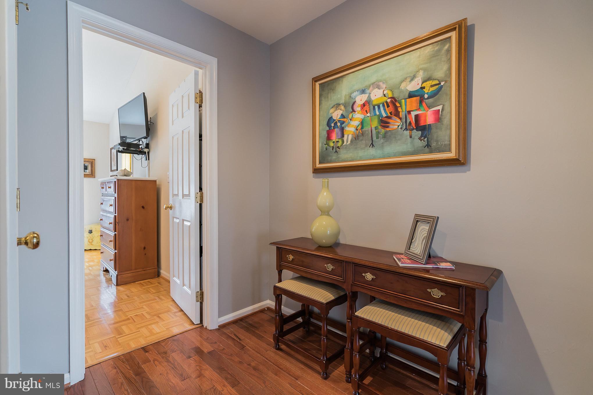 11459 Heritage Commons Way Reston, VA 20194 - Photo 17 of 30 a view of a workspace with furniture and wooden floor