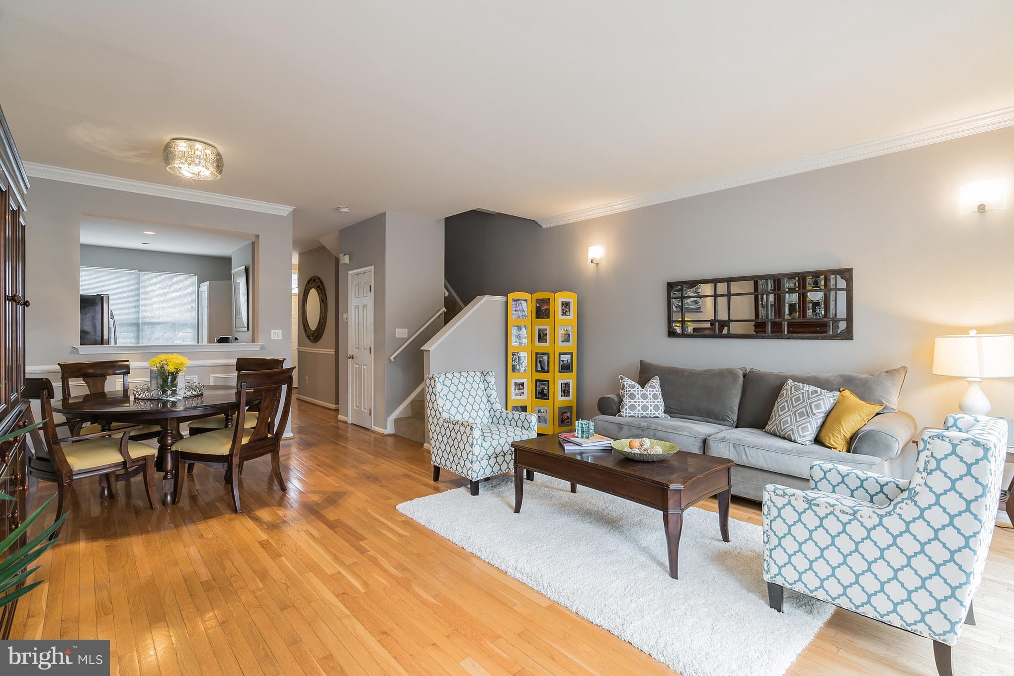 11459 Heritage Commons Way Reston, VA 20194 - Photo 3 of 30 a living room with furniture and a wooden floor