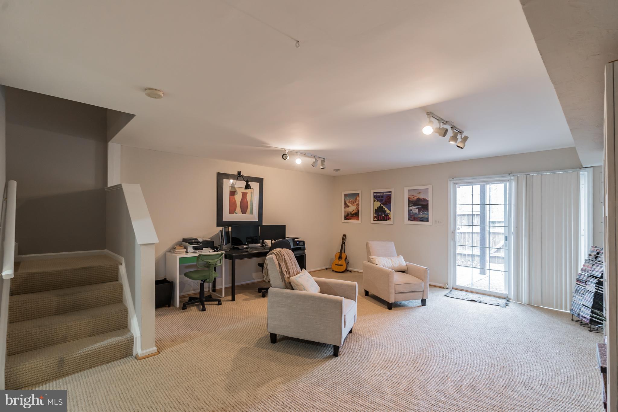 11459 Heritage Commons Way Reston, VA 20194 - Photo 25 of 30 a living room with furniture and large windows
