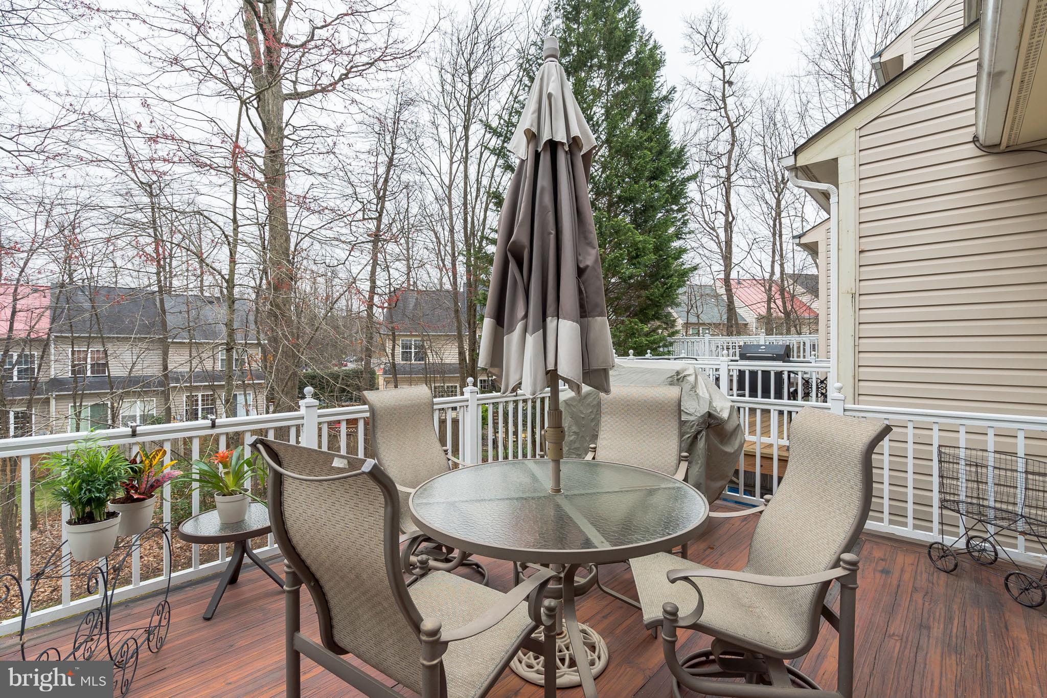 11459 Heritage Commons Way Reston, VA 20194 - Photo 27 of 30 a balcony with table and chairs