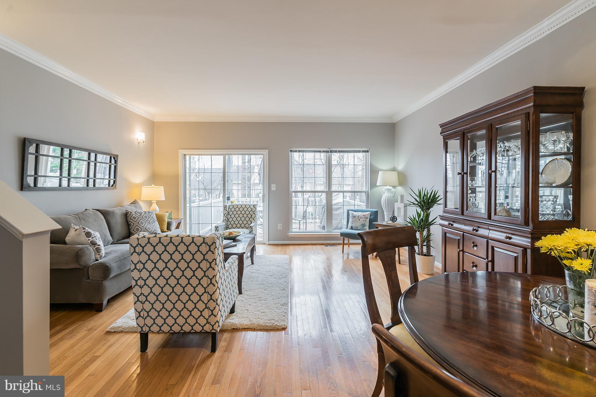 11459 Heritage Commons Way Reston, VA 20194 - Photo 5 of 30 a living room with furniture and wooden floor