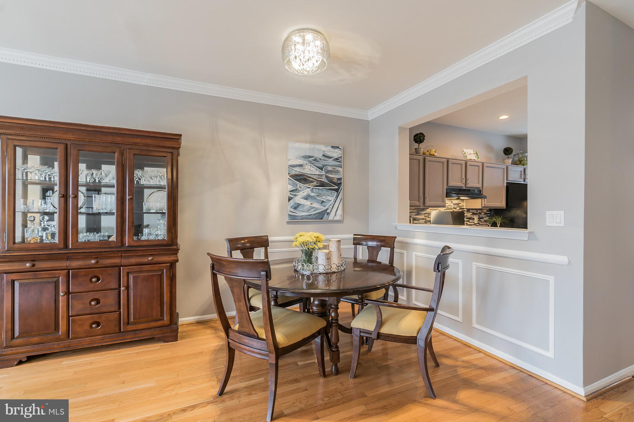 11459 Heritage Commons Way Reston, VA 20194 - Photo 6 of 30 a view of a dining room with furniture