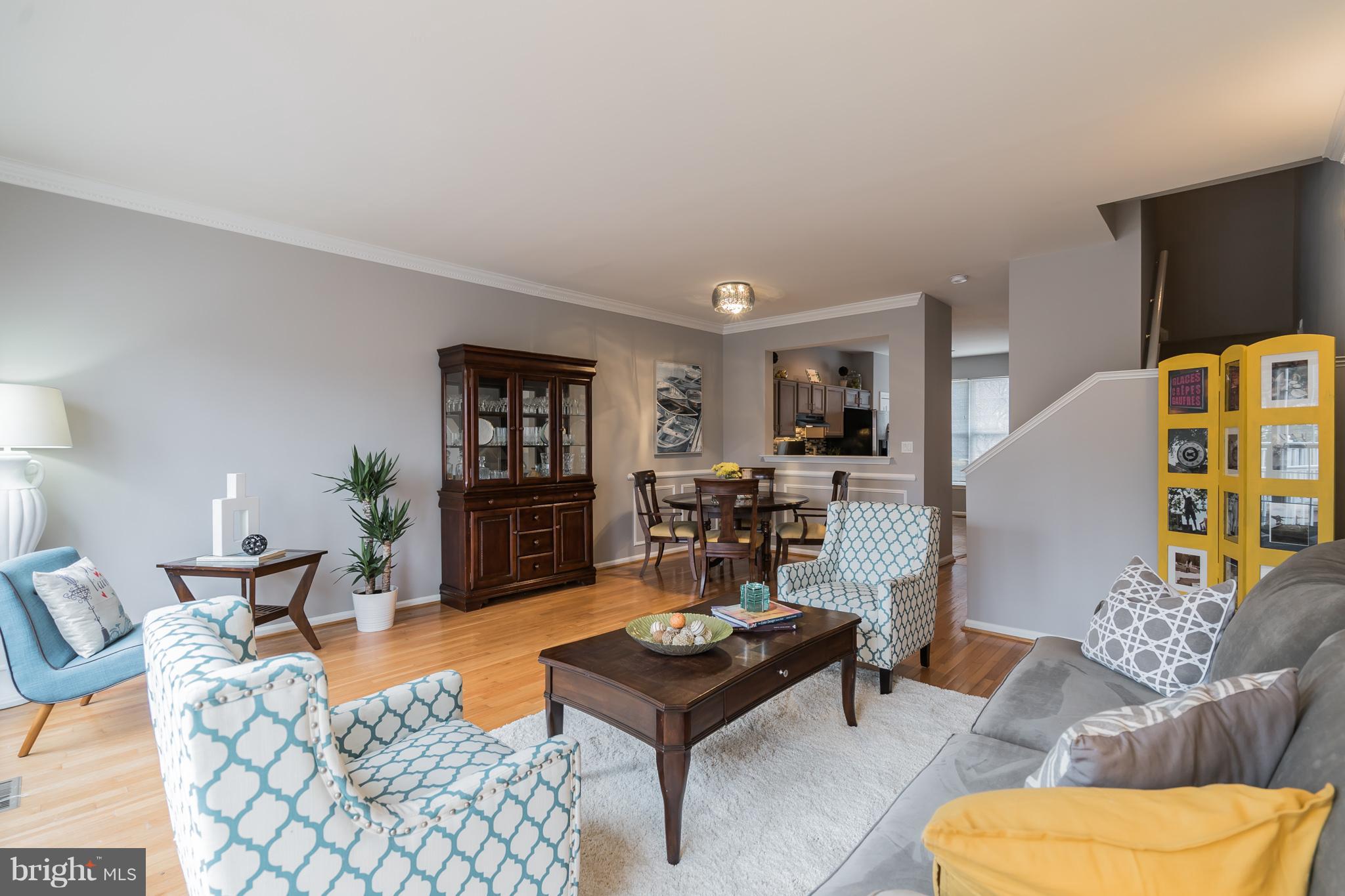 11459 Heritage Commons Way Reston, VA 20194 - Photo 7 of 30 a living room with furniture and wooden floor