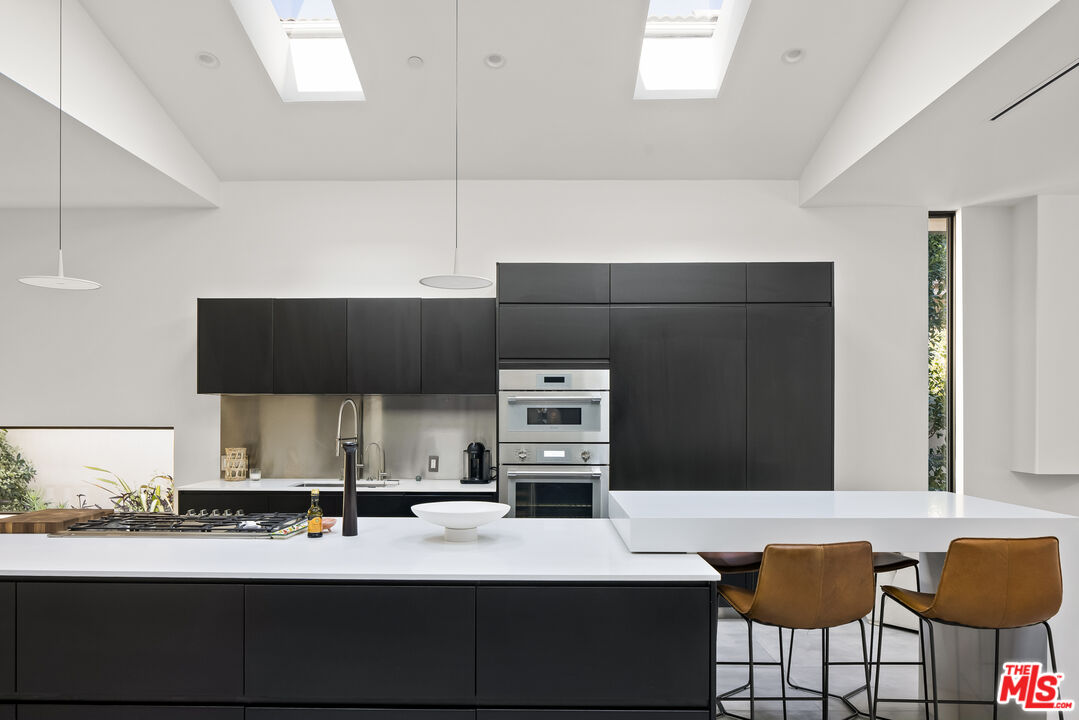4122 Rhodes Avenue Studio City, CA 91604 - Photo 11 of 39 a kitchen with a sink cabinets and appliances
