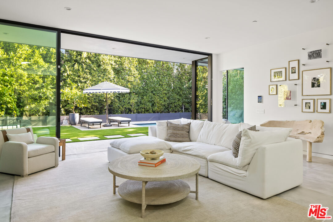 4122 Rhodes Avenue Studio City, CA 91604 - Photo 14 of 39 a living room with furniture and a large window