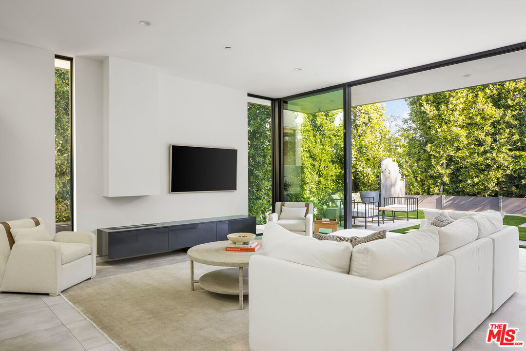 4122 Rhodes Avenue Studio City, CA 91604 - Photo 15 of 39 a living room with furniture and a flat screen tv