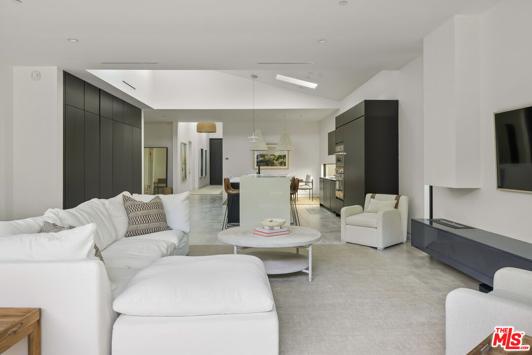 4122 Rhodes Avenue Studio City, CA 91604 - Photo 16 of 39 a living room with furniture and a flat screen tv