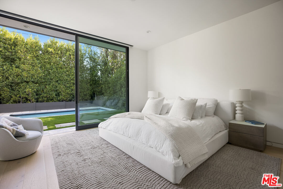 4122 Rhodes Avenue Studio City, CA 91604 - Photo 18 of 39 a bedroom with a bed and a large window