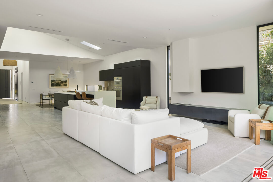 4122 Rhodes Avenue Studio City, CA 91604 - Photo 23 of 39 a living room with furniture and a flat screen tv