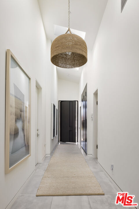 4122 Rhodes Avenue Studio City, CA 91604 - Photo 29 of 39 a view of a hallway with a chandelier fan