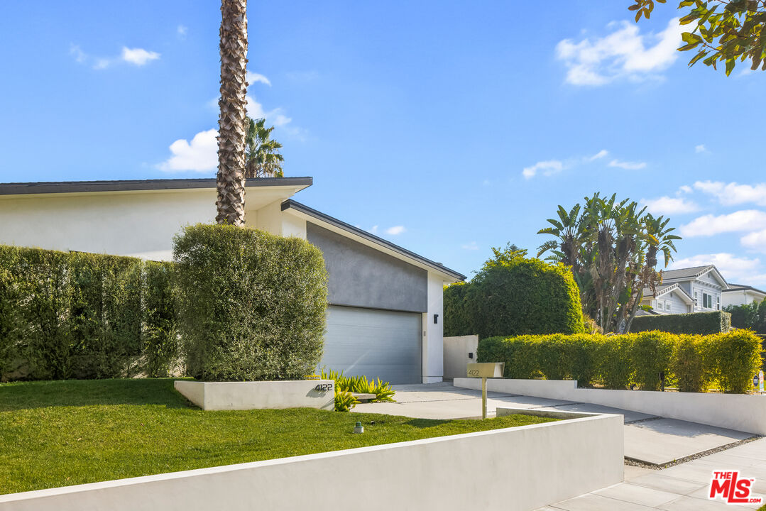 4122 Rhodes Avenue Studio City, CA 91604 - Photo 3 of 39 a front view of a house with garden