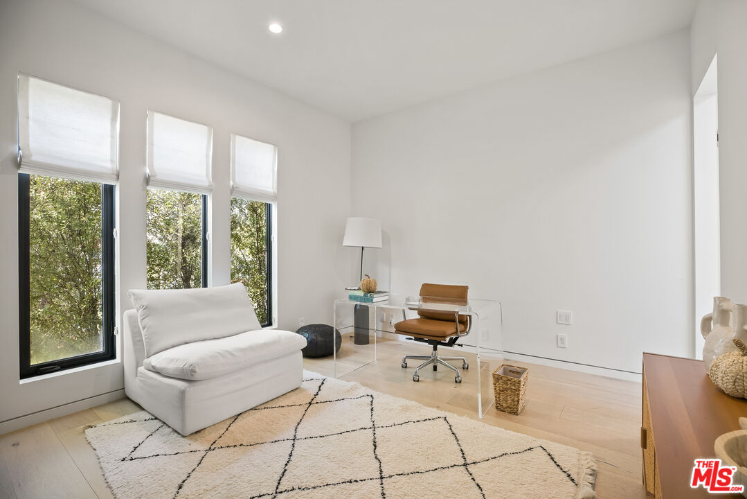 4122 Rhodes Avenue Studio City, CA 91604 - Photo 32 of 39 a living room with furniture and a window