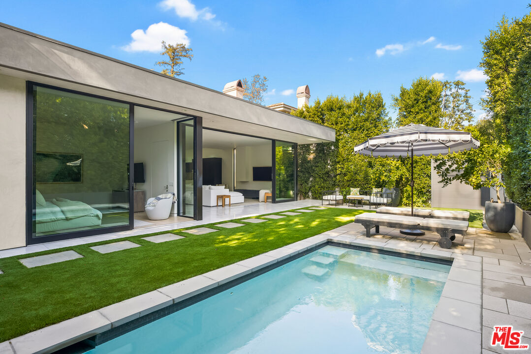 4122 Rhodes Avenue Studio City, CA 91604 - Photo 35 of 39 a view of a house with swimming pool and porch with furniture