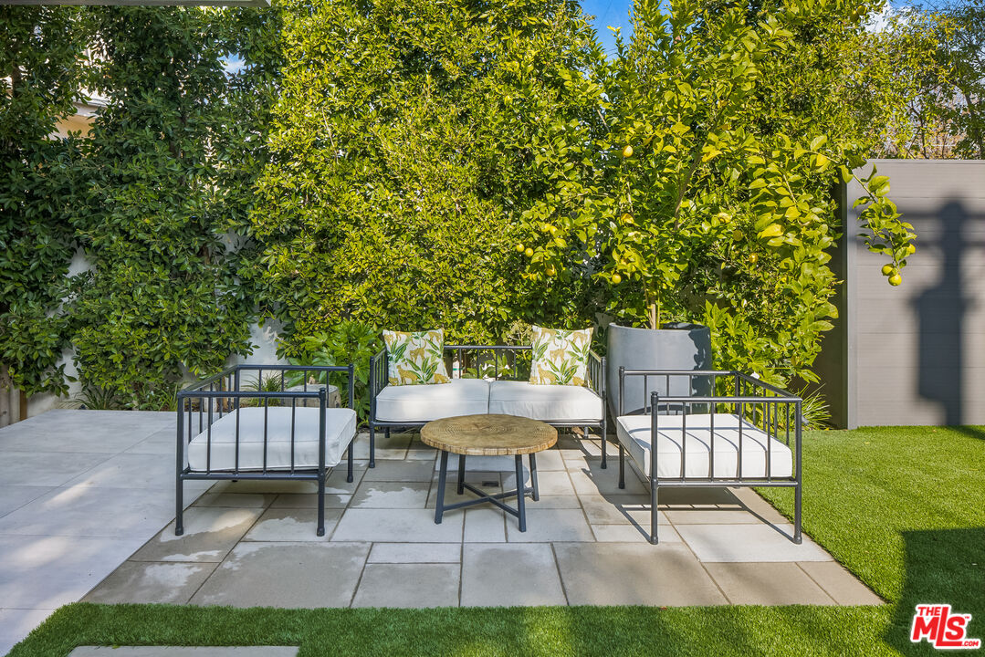 4122 Rhodes Avenue Studio City, CA 91604 - Photo 37 of 39 a view of a chair and tables in the back yard of the house