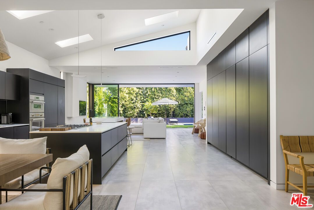 4122 Rhodes Avenue Studio City, CA 91604 - Photo 6 of 39 a large kitchen with kitchen island a large window in it