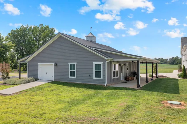 a living room with furniture fireplace and a flat screen tv