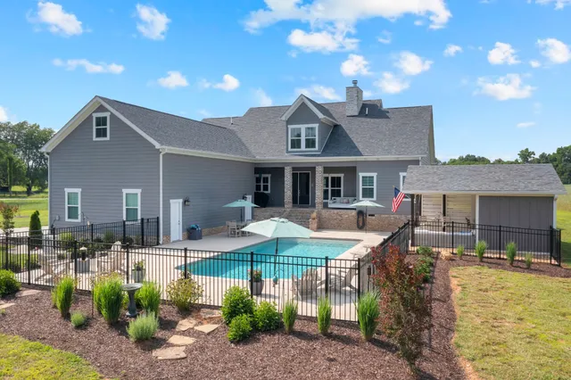 a spacious bathroom with a double vanity sink a mirror a vanity and a