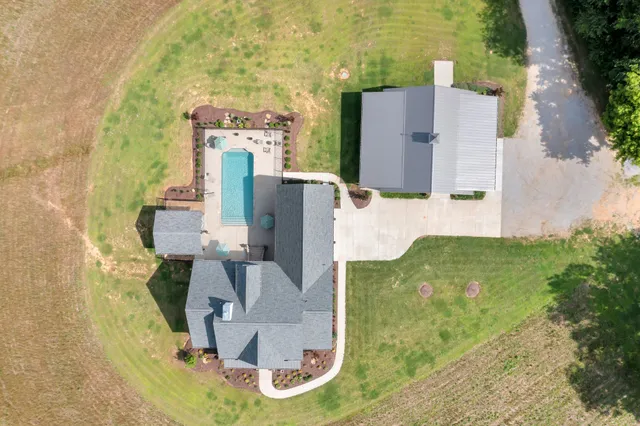 a large kitchen with stainless steel appliances granite countertop a lot of counter space and a sink