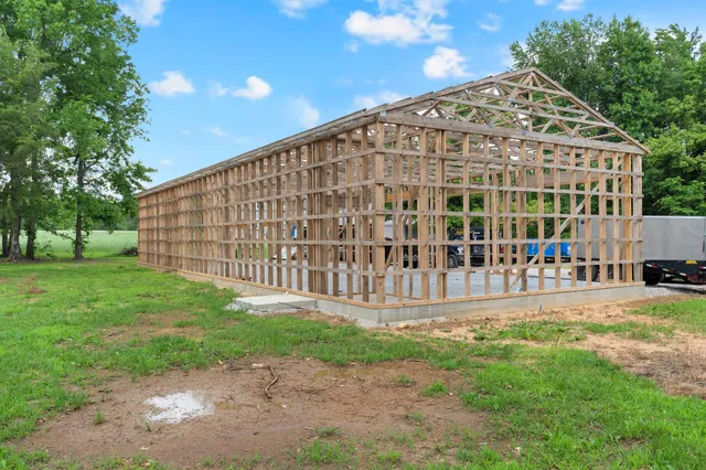 a view of a hallway to a livingroom with furniture