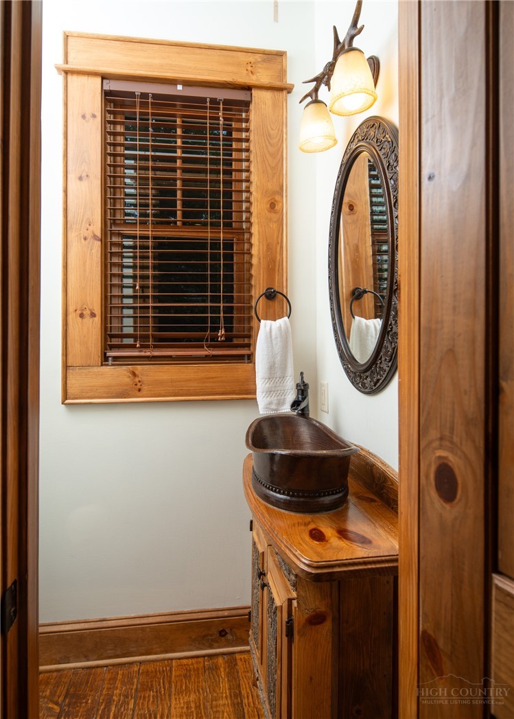 153 Stonecrop Lane Boone, NC 28607 - Photo 13 of 50 a bathroom with a sink and a mirror