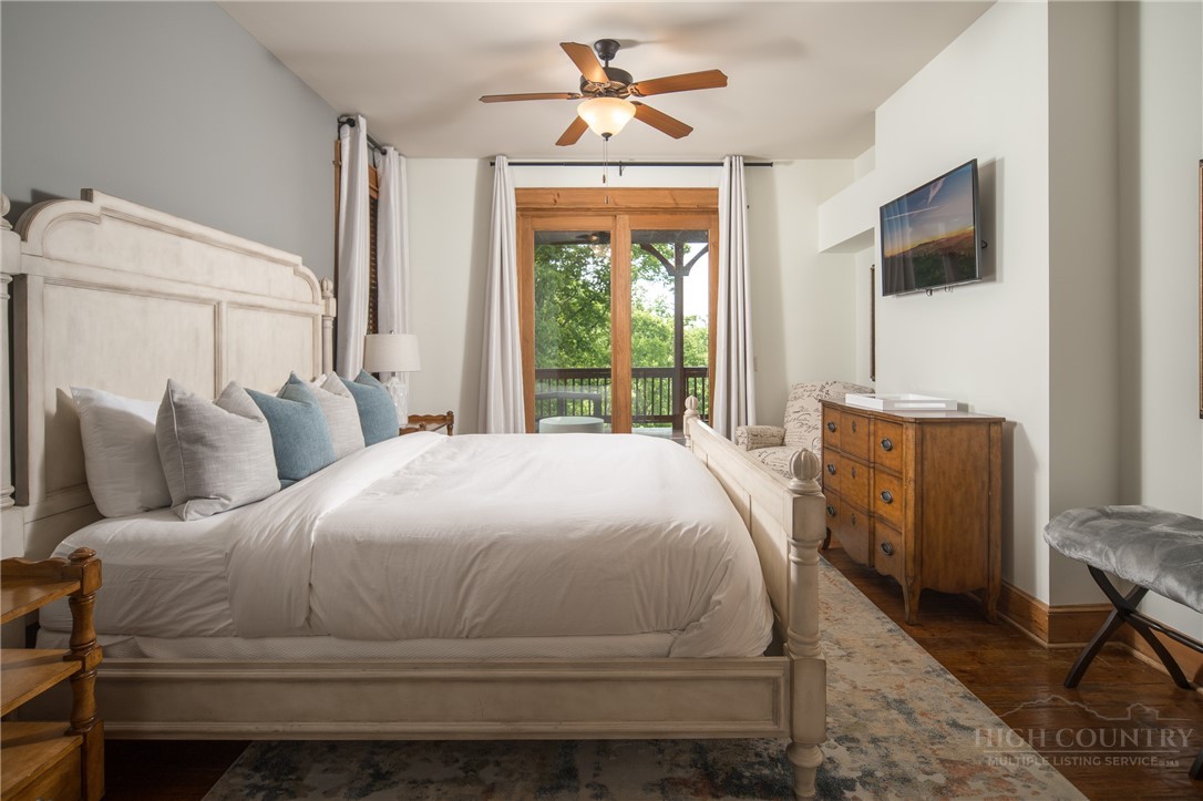153 Stonecrop Lane Boone, NC 28607 - Photo 16 of 50 a bedroom with a bed and a window