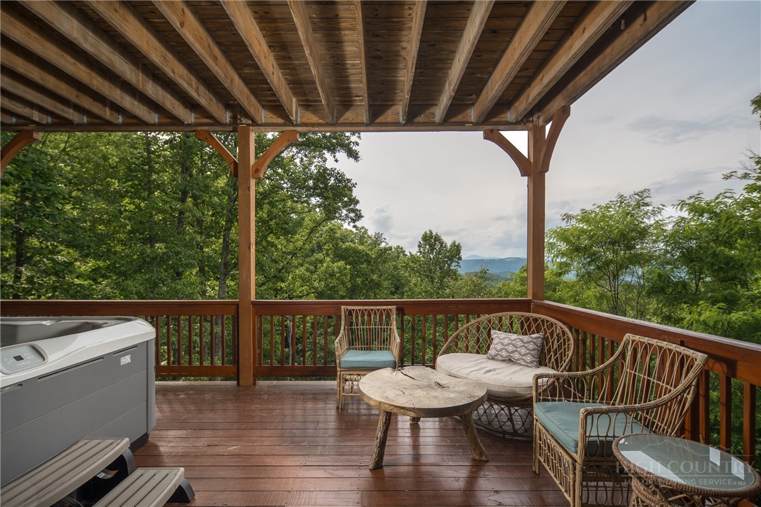 153 Stonecrop Lane Boone, NC 28607 - Photo 26 of 50 a view of balcony with wooden floor and outdoor seating
