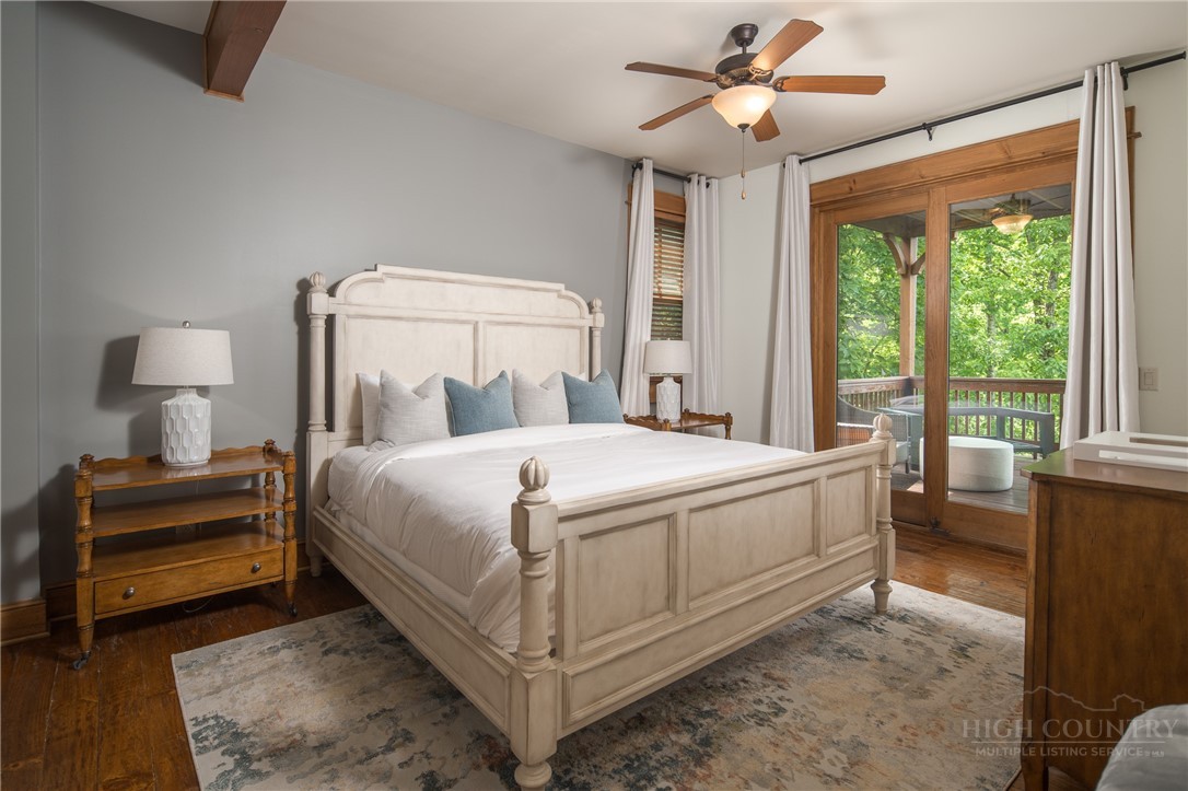 153 Stonecrop Lane Boone, NC 28607 - Photo 27 of 50 a bed sitting in a bedroom next to a window
