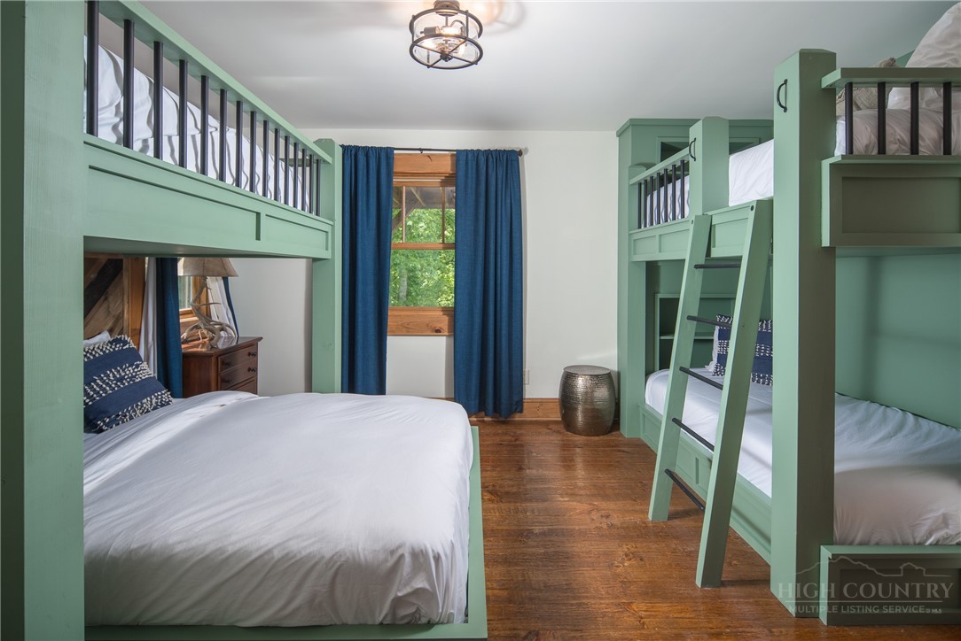 153 Stonecrop Lane Boone, NC 28607 - Photo 37 of 50 a bedroom with a bed and a window