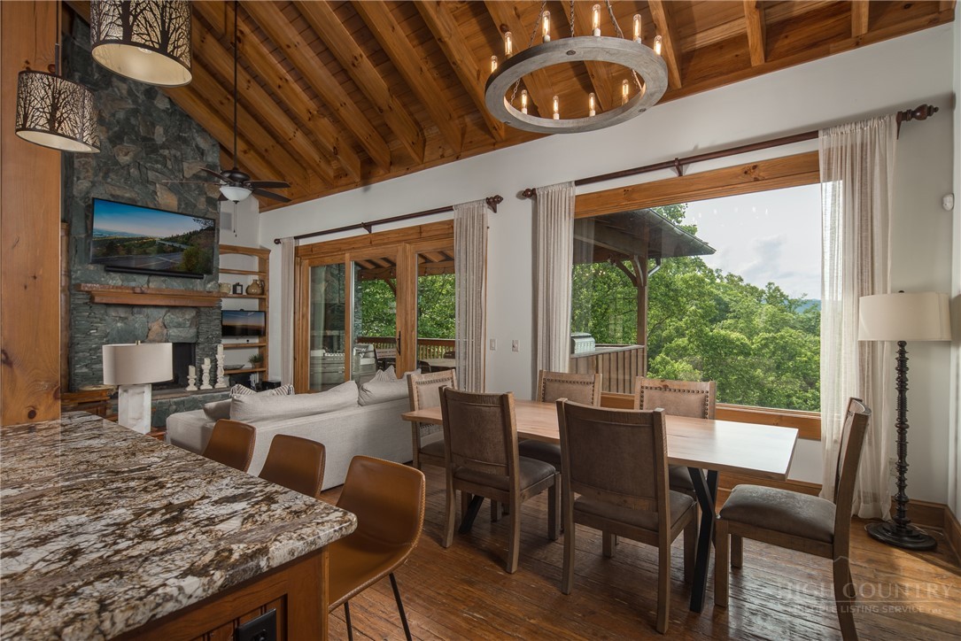 153 Stonecrop Lane Boone, NC 28607 - Photo 4 of 50 a view of a dining room with furniture window and outside view