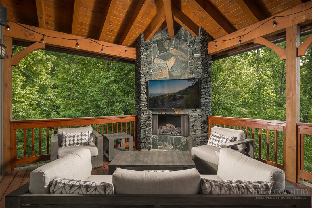 153 Stonecrop Lane Boone, NC 28607 - Photo 6 of 50 a view of a couches in the patio