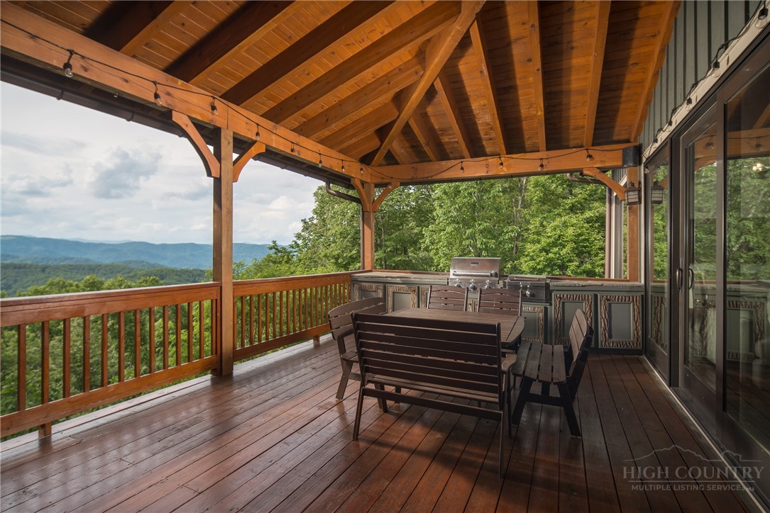 153 Stonecrop Lane Boone, NC 28607 - Photo 8 of 50 a view of a balcony with furniture and wooden floor