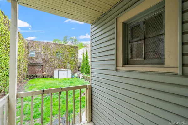 a view of a balcony with an outdoor space