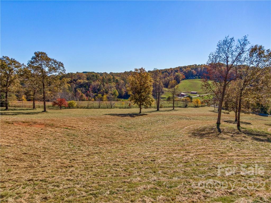 3135 Polk County Line Road Rutherfordton, NC 28139 - Photo 16 of 48 a view of dirt road with a building in the background