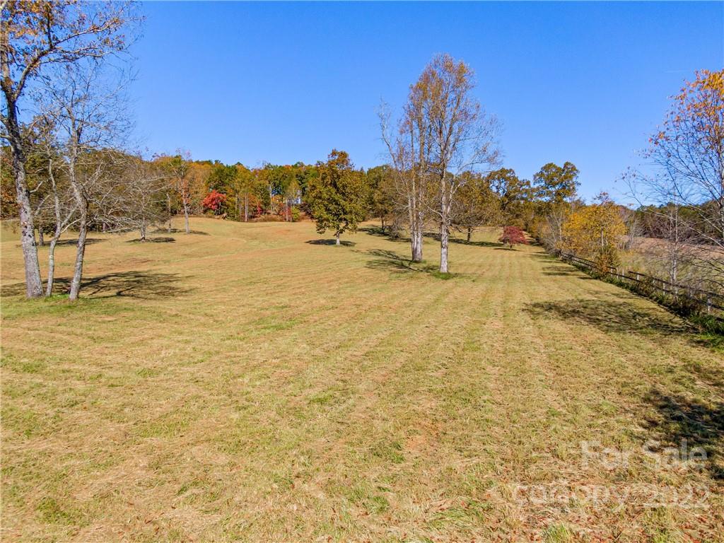 3135 Polk County Line Road Rutherfordton, NC 28139 - Photo 17 of 48 a view of a lake with a building in the background
