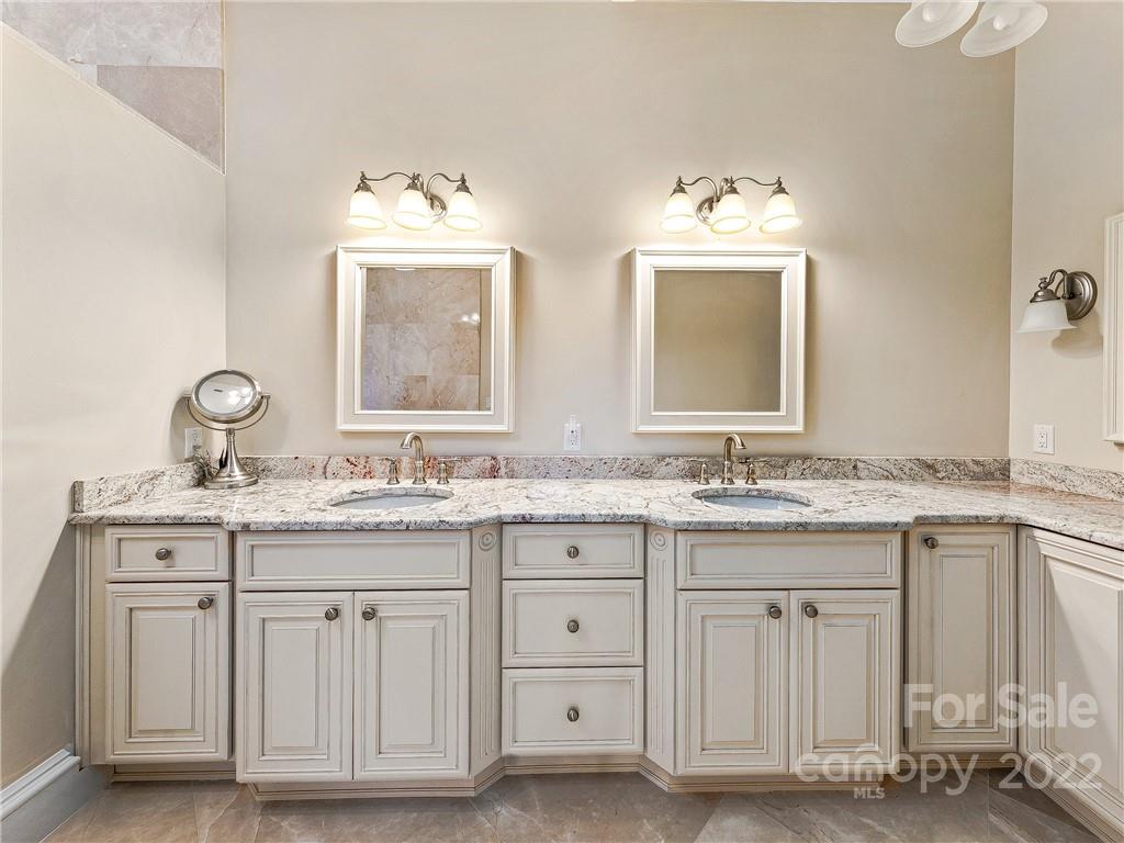 3135 Polk County Line Road Rutherfordton, NC 28139 - Photo 41 of 48 a bathroom with a granite countertop sink double and mirror