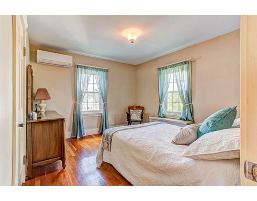 3 Locke Road Chelmsford, MA 01824 - Photo 20 of 31 a bedroom with a bed and large windows