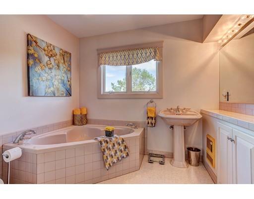 3 Locke Road Chelmsford, MA 01824 - Photo 22 of 31 a bathroom with a tub sink and mirror