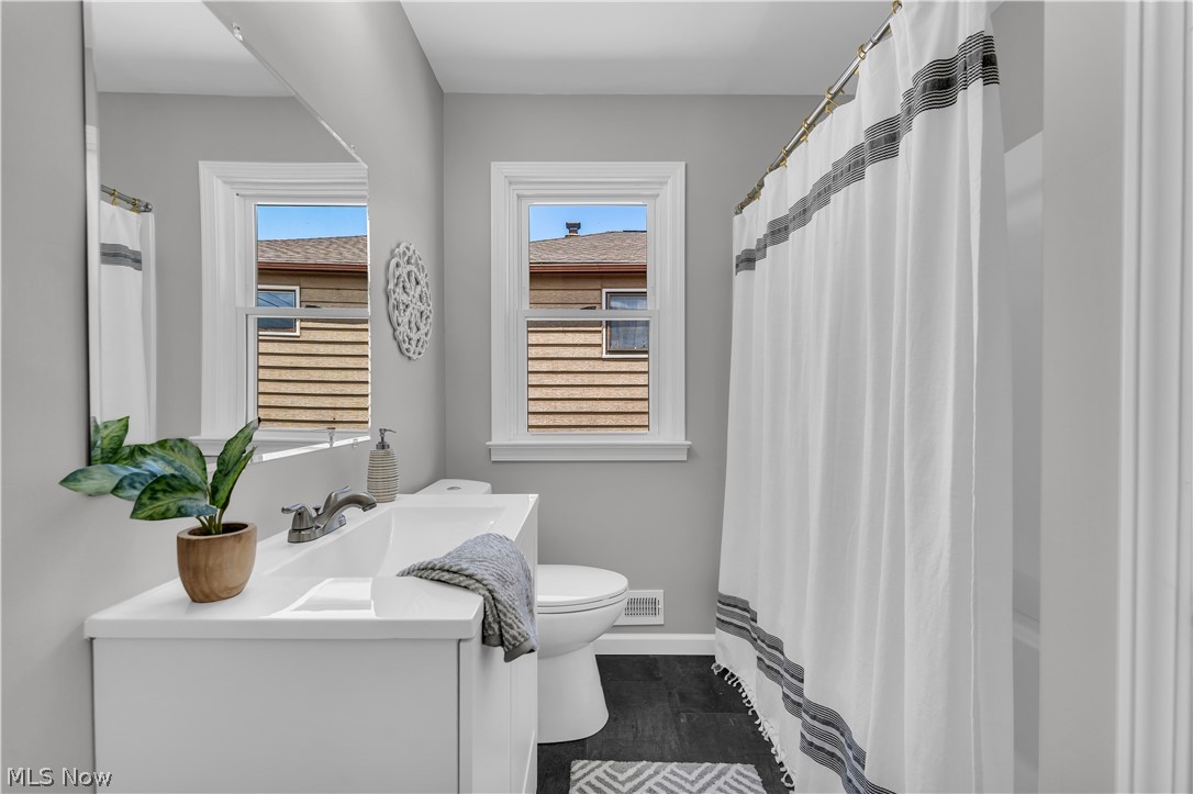 4322 Roadoan Road Brooklyn, OH 44144 - Photo 21 of 27 Bathroom featuring vanity, hardwood / wood-style floors, and toilet
