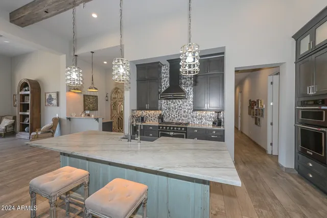 a view of a kitchen and dining table chairs