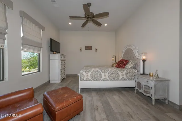 a bedroom with bed and window