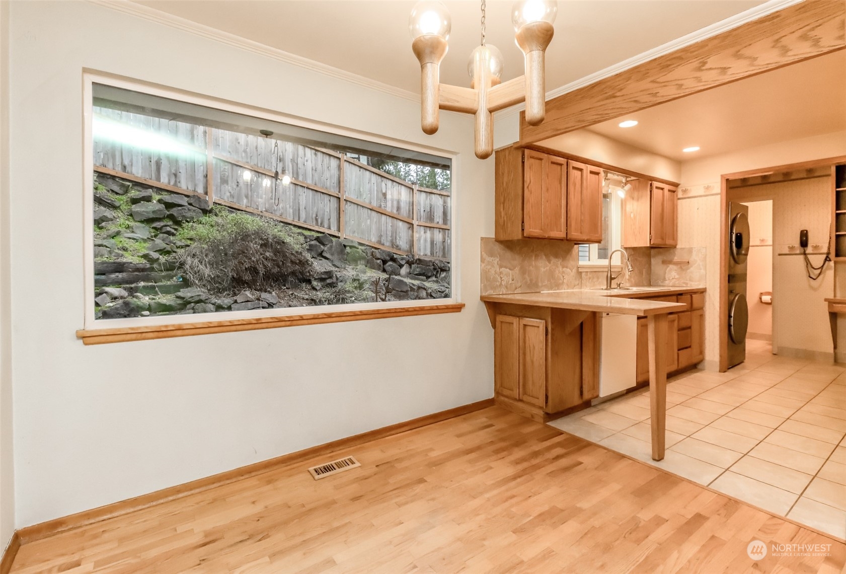 425 Ramsdell Street Fircrest, WA 98466 - Photo 13 of 39 a kitchen with stainless steel appliances granite countertop a stove a sink and a refrigerator