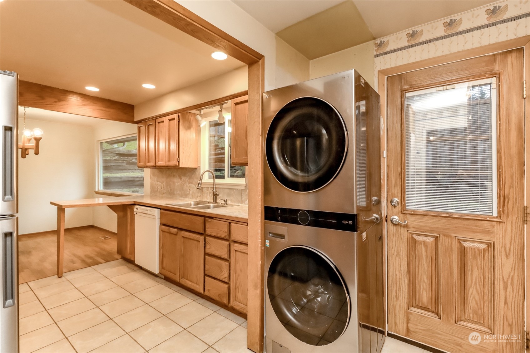 425 Ramsdell Street Fircrest, WA 98466 - Photo 15 of 39 a view of a hallway with washer and dryer