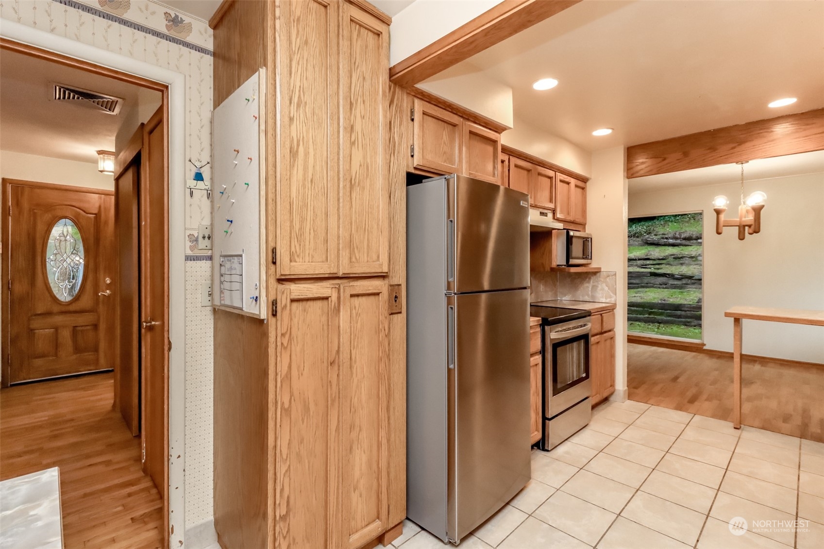 425 Ramsdell Street Fircrest, WA 98466 - Photo 17 of 39 a kitchen with stainless steel appliances granite countertop a refrigerator and a sink