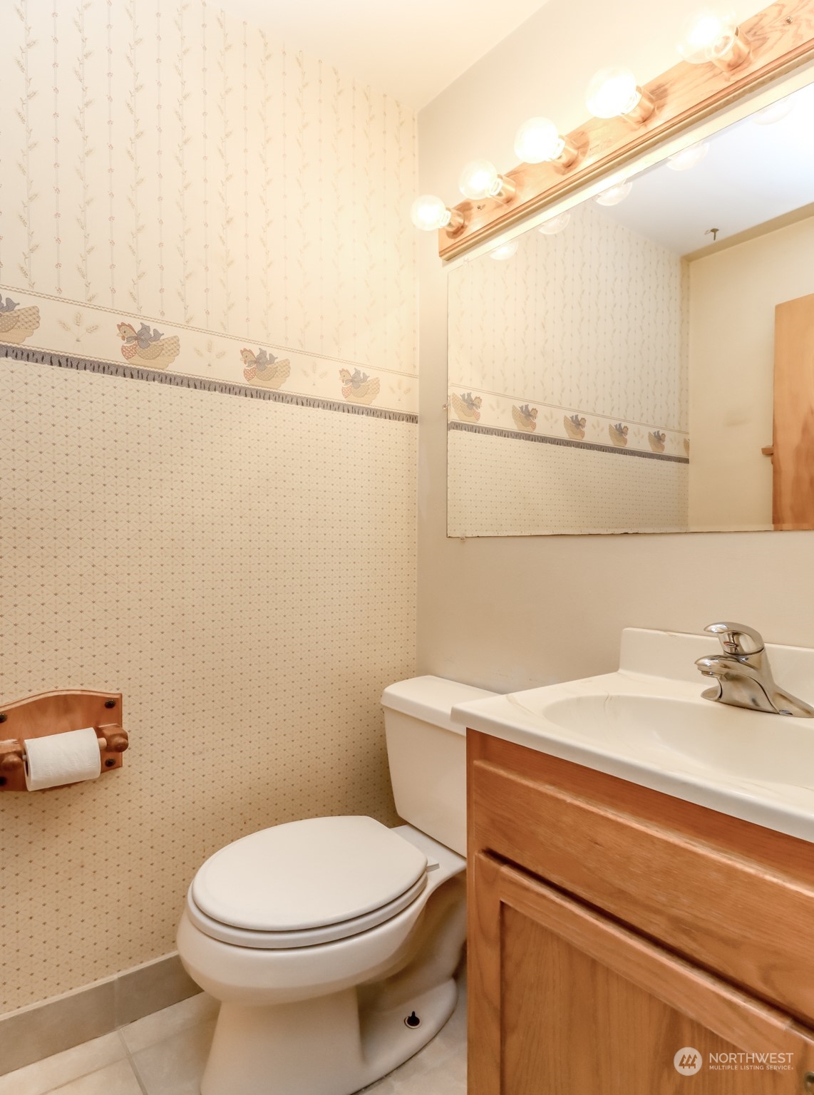 425 Ramsdell Street Fircrest, WA 98466 - Photo 19 of 39 a bathroom with a sink a toilet and a mirror