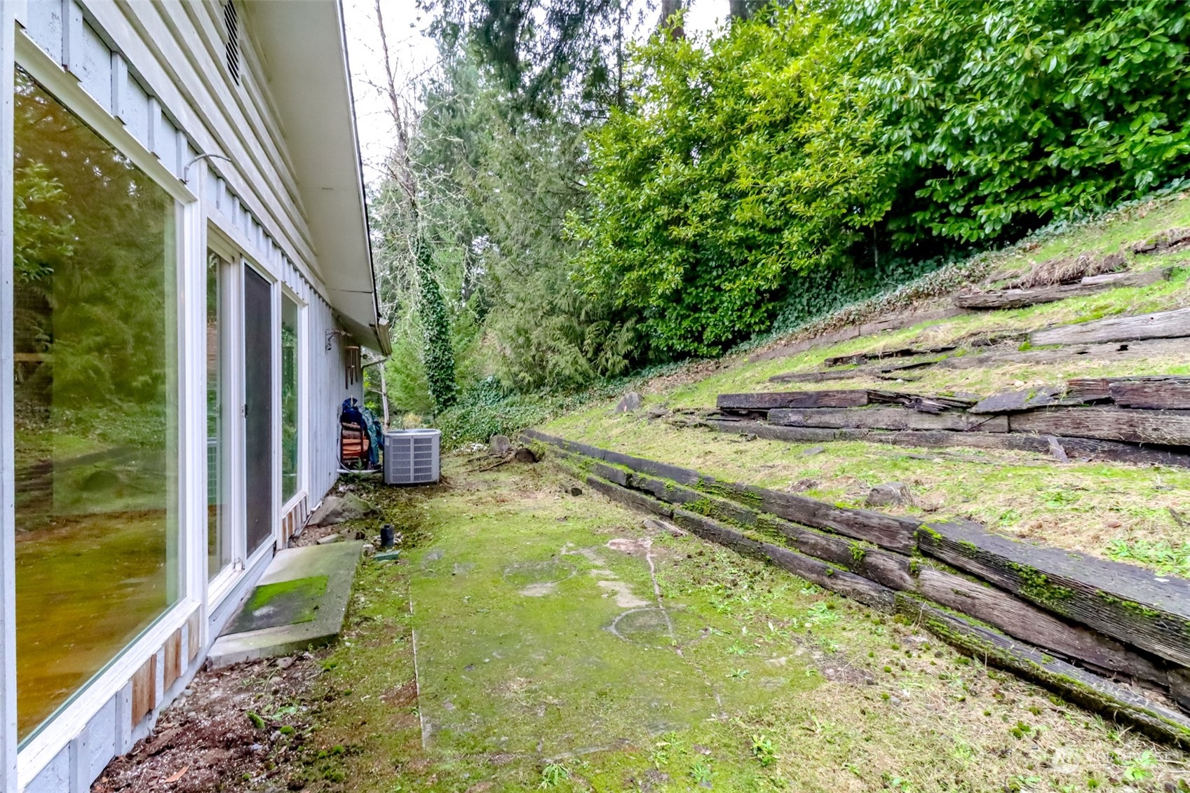 425 Ramsdell Street Fircrest, WA 98466 - Photo 30 of 39 a backyard of a house with a yard and outdoor seating