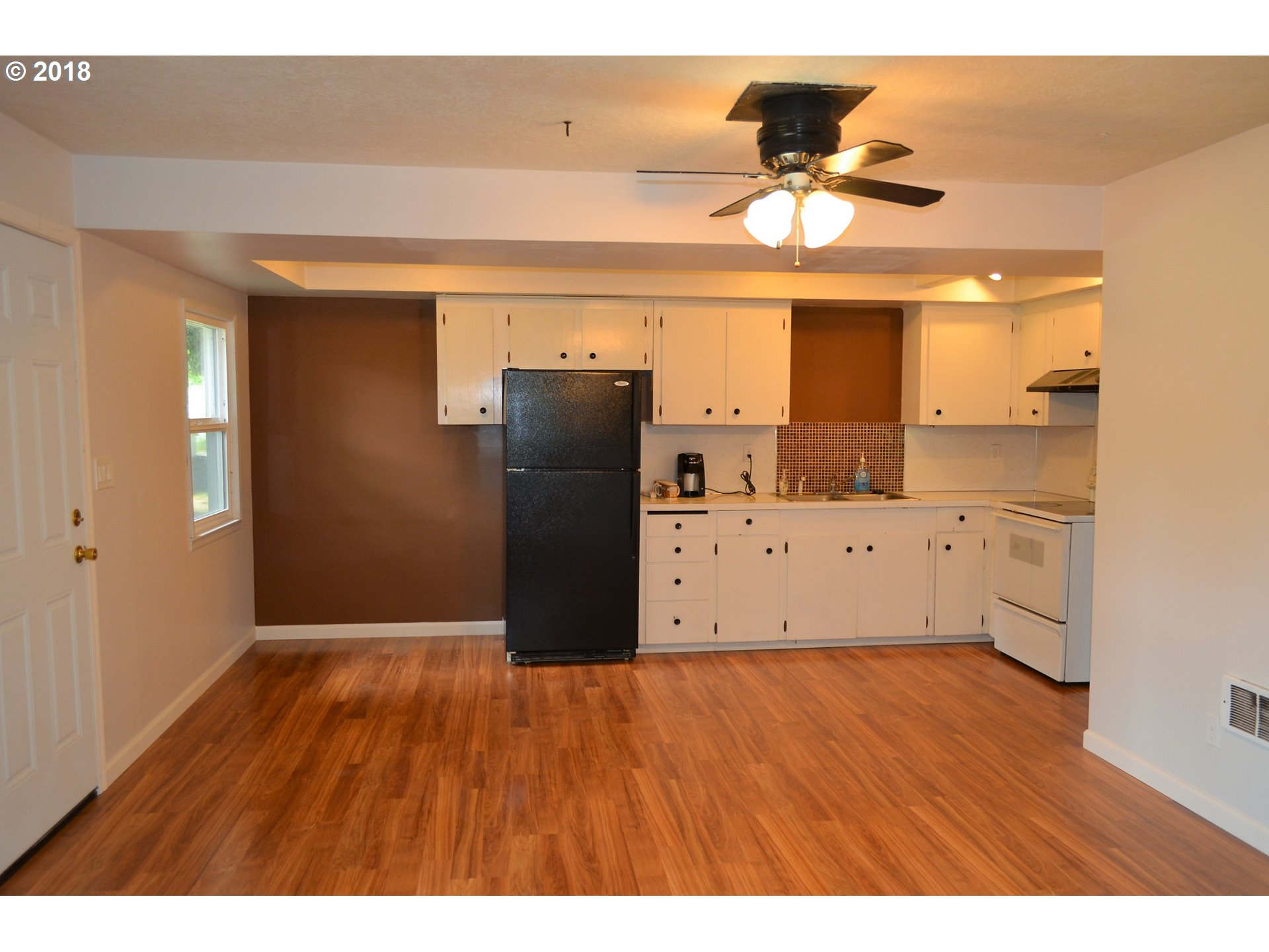 912 Northeast 194th Street Ridgefield, WA 98642 - Photo 3 of 29 a view of kitchen with refrigerator and window