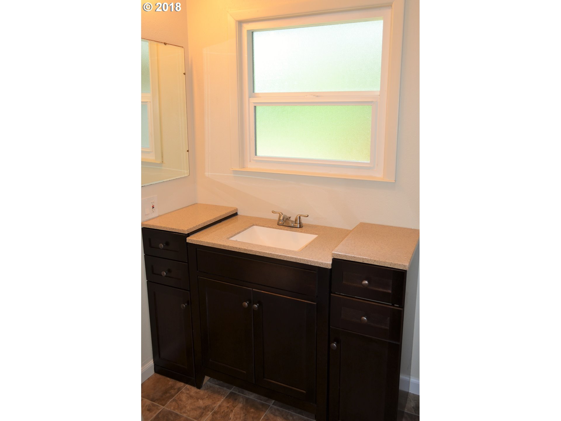 912 Northeast 194th Street Ridgefield, WA 98642 - Photo 10 of 29 a bathroom with a sink and a mirror
