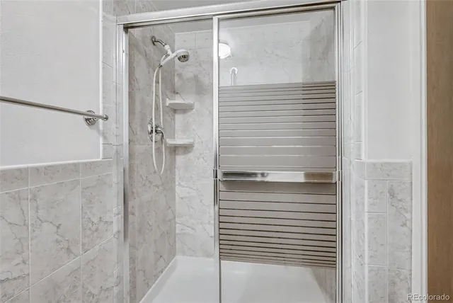 a view of room with window and wooden floor
