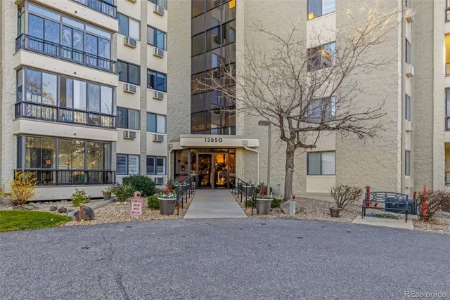 a view of hallway with wooden floor